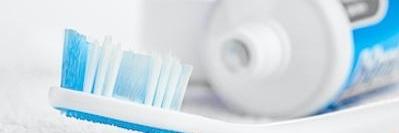 Close up of tooth brush and toothpaste at Bellevue dentist office