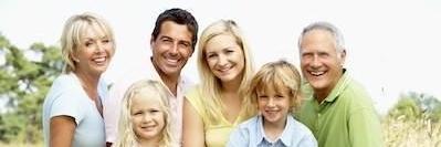 Family dentistry patients smiling outside at Freeman Park in Bellevue NE