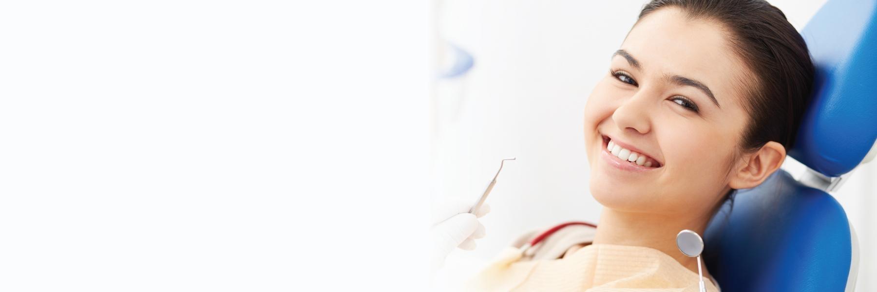 Woman smiling in chair at Bellevue dentist near me